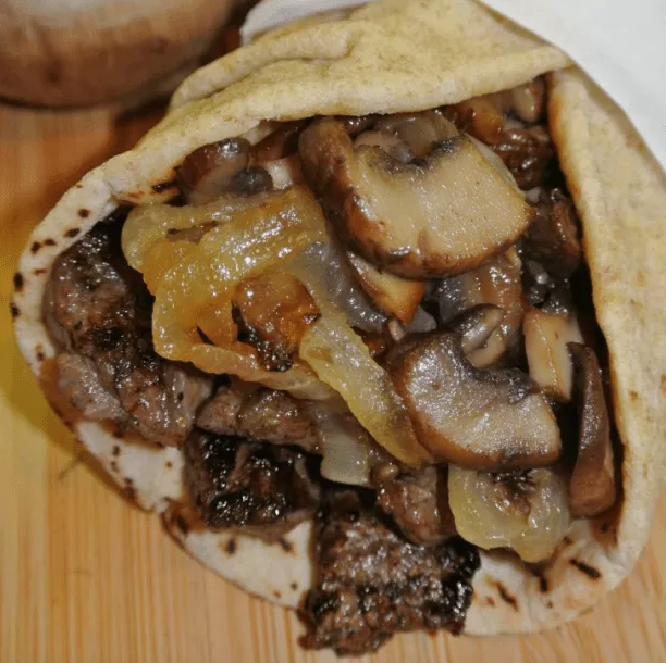 greek steak pita with caramelized onions and mushrooms